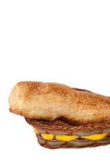 Pastry stuffed with ham and cheese in the wooden basket
