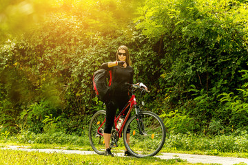 Obraz premium Happy Young Woman riding bicycle outside. Healthy Lifestyle.