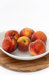 White bowl with peaches