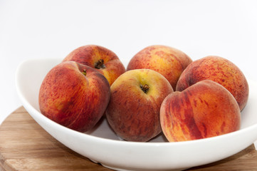 White bowl with peaches