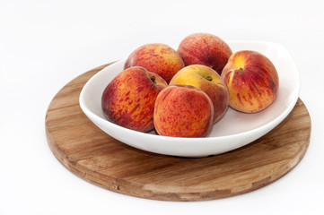 White bowl with peaches