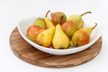 White bowl filled with fresh pears