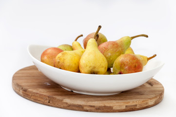 White bowl filled with fresh pears