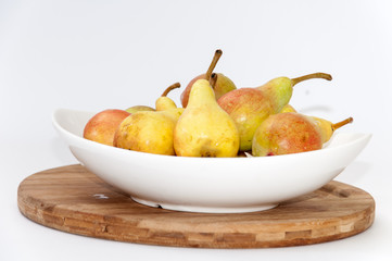 White bowl filled with fresh pears