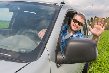 Naklejka premium Man sitting in a car