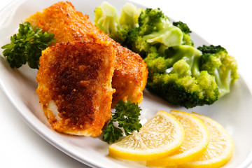 Fish dish - fried fish fillets and vegetables 