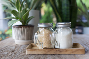 sugar in glass jar with small tree in the pot plant decorated