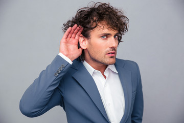Businessman making gesture to her you