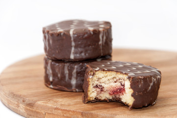 Slice of chocolate muffin on the wooden board