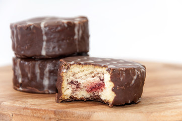 Slice of chocolate muffin on the wooden board