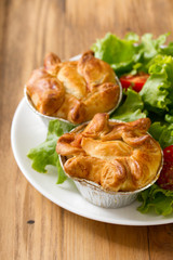 portuguese empada de galinha with salad