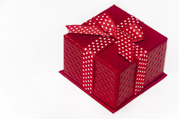 Closed beautiful red box with bow