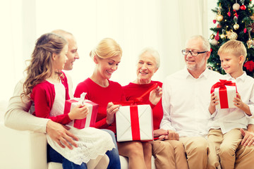 smiling family with gifts at home