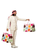 Arab man with shopping bags on white