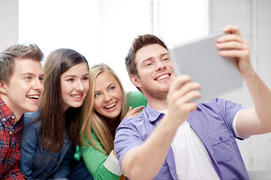 group of happy high school students with tablet pc