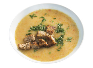 Squash soup in a bowl, isolated on a white background.