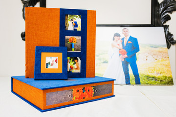 blue and orange textile wedding photo book and album