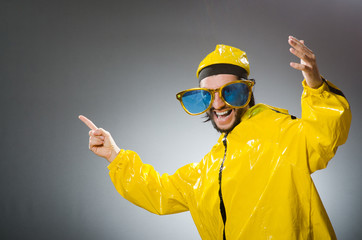 Man wearing yellow suit in funny concept