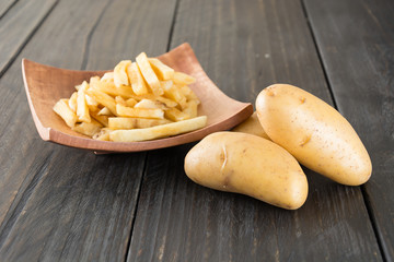 french fries on wood background