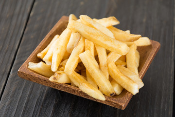 french fries on wood background