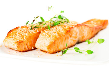 Grilled salmon on white plate