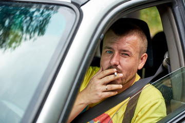 Man smoking in the car