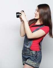 Beautiful young woman with camera