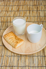 Breakfast pitcher of milk and bread