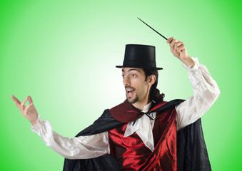 Magician doing tricks on white