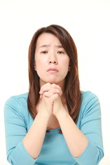  woman folding her hands in prayer