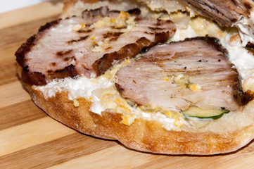 Homemade hamburger with smoked ham and vegetables