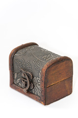Closed wooden chest over white background
