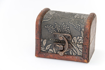 Closed wooden chest over white background