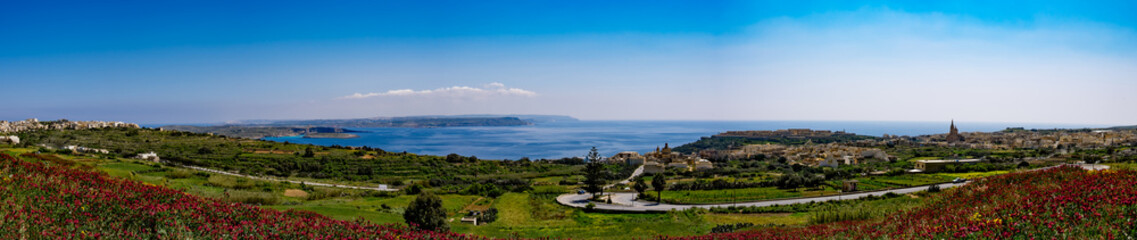 Panorama view of Mgarr city with green field. Gozo, Malta