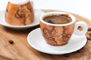 Cup of coffee on the wooden board