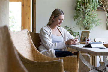 Woman using technology at home