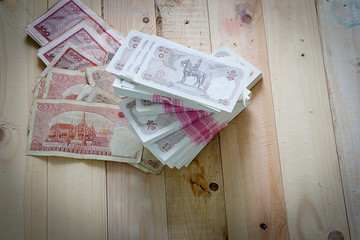 Thai Baht money on the wood floor