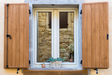 window with open wooden shutters