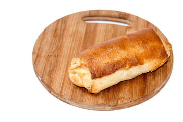 Hot dog bun on the kitchen wooden board