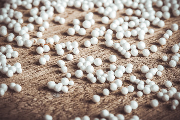 Pieces of foam plastic like snow balls on the background of the