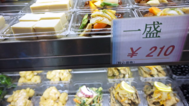Video of Osaka, Japan -March 2015: Japanese tofu and other side dishes selling at the market