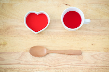 red heart cup,red drinking sweet water in a cup and the spoon