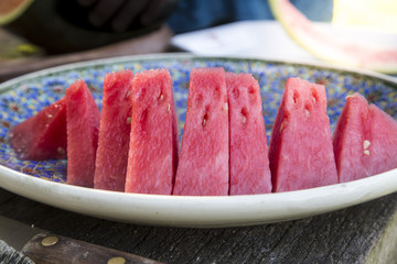 close up of a sliced water melon on a plate
