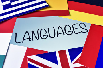 different flags and the word languages in the screen of a tablet