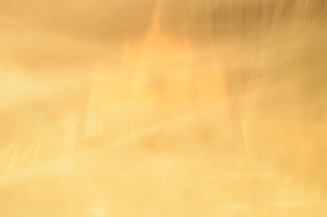 Abstract background of a lit church with motion blur