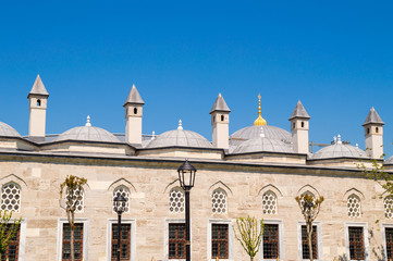 Fototapeta na wymiar Mosque or islamic palace windows, domes and chimneys