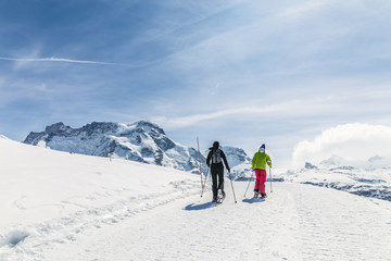 Fototapeta na wymiar Women walking on ski in the snow mountain.