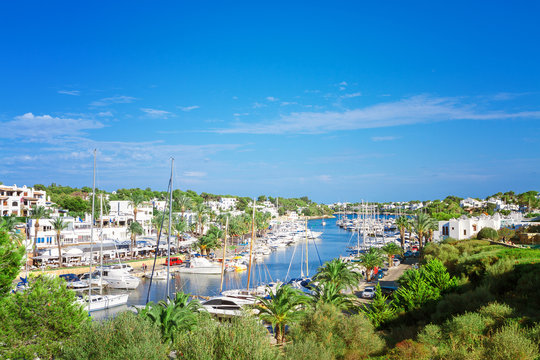 Fototapeta Panoramic view of the Cala D'Or yacht marina harbor with recreat