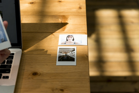 Photos illuminated by the Sun on a Table