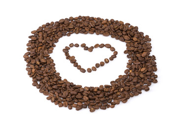 Circle roasted coffee beans with a heart in the middle.